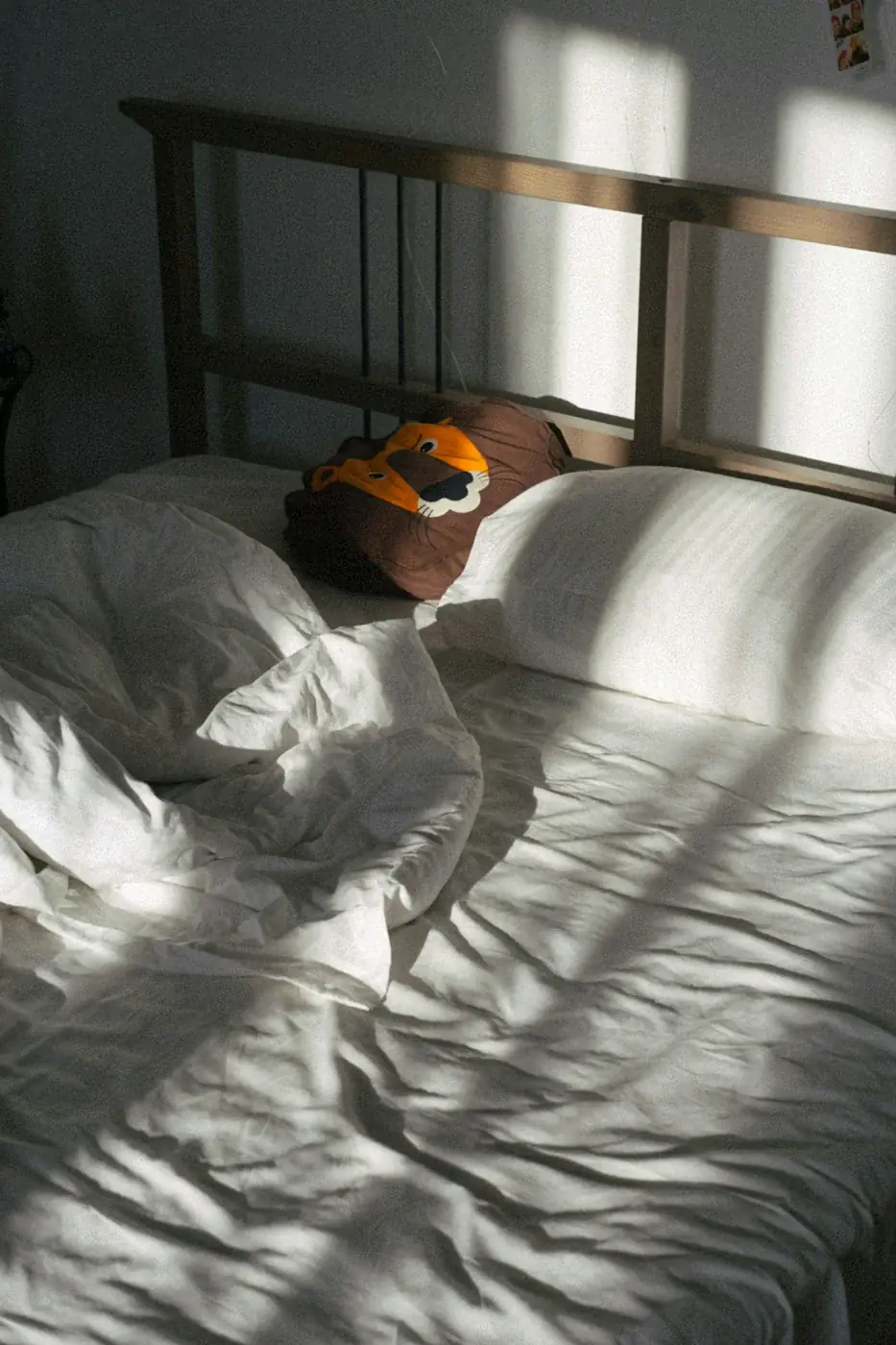 Bed with white bedding and pillows